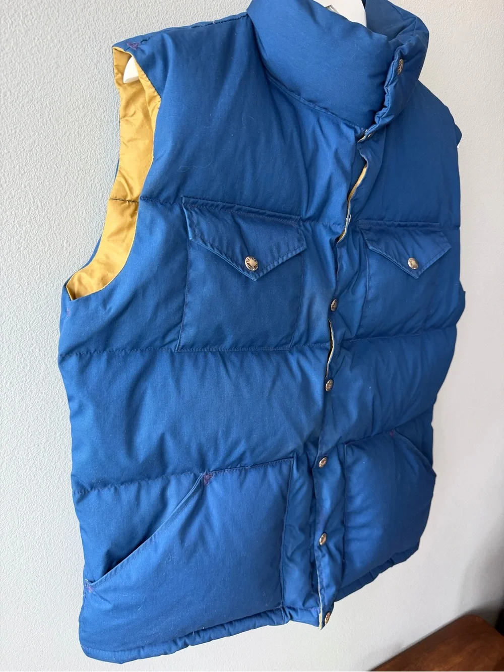 The North Face vintage blue goose down fill snap up puffer vest Men’s sz L